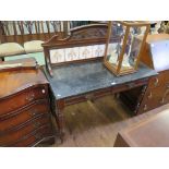 An Edwardian walnut wash stand, the carved raised back with tiled panel over a marble top with two