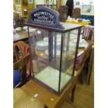 A Mazawattee chocolates display cabinet, with inscribed top panel and sides, 43cm wide, 81cm high