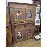 An oak Romanesque style carved cabinet/ linen press, with rosette carved frieze over four arcaded