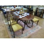 A reproduction crossbanded mahogany dining room suite, with dining table and seven chairs