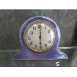 A silver and mauve enamel bedside clock fitted with eight day movement (not working)