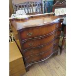 A reproduction mahogany serpentine chest of drawers, on bracket feet, 76cm wide