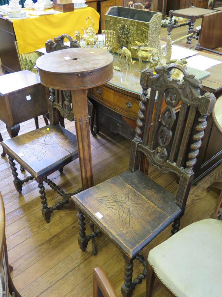 A pair of late Victorian oak occasional chairs, with barley twist and vine carved backs on sold