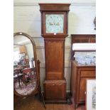 An early 19th Century oak long case clock, with fluted pillars and pilasters and shaped trunk