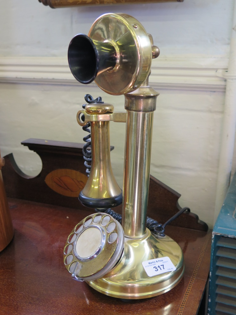 A brass stick telephone 31.5cms high, with modern wiring