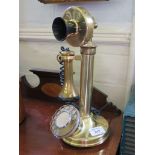 A brass stick telephone 31.5cms high, with modern wiring