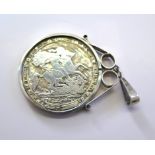 A George III crown coin made into a pendant