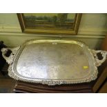 A large silver plated tray with armorial to the centre