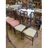 A pair of Edwardian mahogany bedroom chairs with inlaid urn motif to the cross railed backs, and