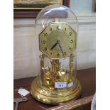 A German brass anniversary clock, by Kan, with octagonal dial and square pendulum bobs, 30cm high