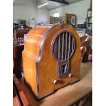 A 1930's walnut cased Philco radio, 48cm high