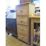 A pine tall chest of four drawers on pad feet, 50cm wide, 116cm high