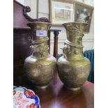 A pair of early 20th century Chinese brass baluster vases, with dragon, bird and butterfly motifs