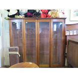 A mahogany four door bookcase with glazed doors, 168cm x 160cm