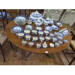 A William IV mahogany snaptop breakfast table, the oval top on a turned stem with four moulded