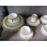 A Limoges Theodore Haviland part tea set with yellow border of roses and ribbon ties