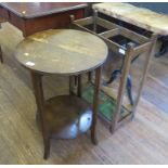 An oak circular two tier occasional table and an umbrella stand