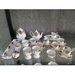 Royal Albert Old Country Roses miniature tea service, with teapot and six cups and saucers, three