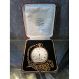 A rolled gold pocket watch on rolled gold chain set with half sovereign