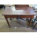 An Edwardian mahogany side table, with frieze drawer and turned legs 91cm wide, and a tripod