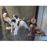 A Rosenthal figure of three dalmatians, impressed F. Heidenreich, 27cm long, another of a cockerel