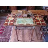 A Middle Eastern inlaid desk, the square hinged top opening to a rising superstructure and writing