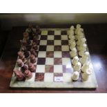 A hardstone chess set, of conventional form, 7.5cm high