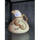 A Royal Worcester jug of relief moulded basket and salamander design, restored, 15cm high