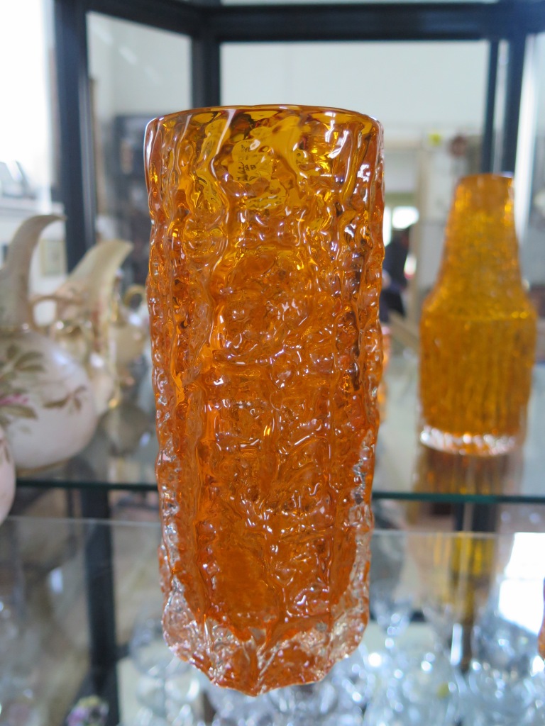 A Whitefriars orange glass bark effect vase, cylindrical 19cm high