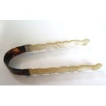 A 19th century mother of pearl and tortoiseshell pair of sugar tongs