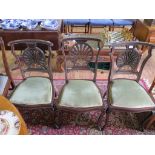 A set of three inlaid mahogany salon chairs, the pierced inlaid shell shape backs above