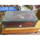 A Regency rosewood and brass bound writing box, the hinged lid enclosing a hinged writing surface