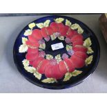 A Moorcroft apricot and blackberry plate, dated 1996 and initialled C.B. 26cm diameter