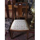 A pair of satinwood bedroom chairs by Waring and Gillows, the ebony strung backs with book veneer