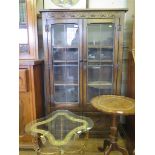 An oak Old English style display cabinet, with lead glazed doors above lozenge carved panelled