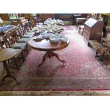 A Heriz style carpet, with red field, radiating medallion and lanterns filled with floral scrolls