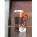 A Doulton Silicon leather effect tankard with silver mounted rim, stamped 9962 13.5cm high