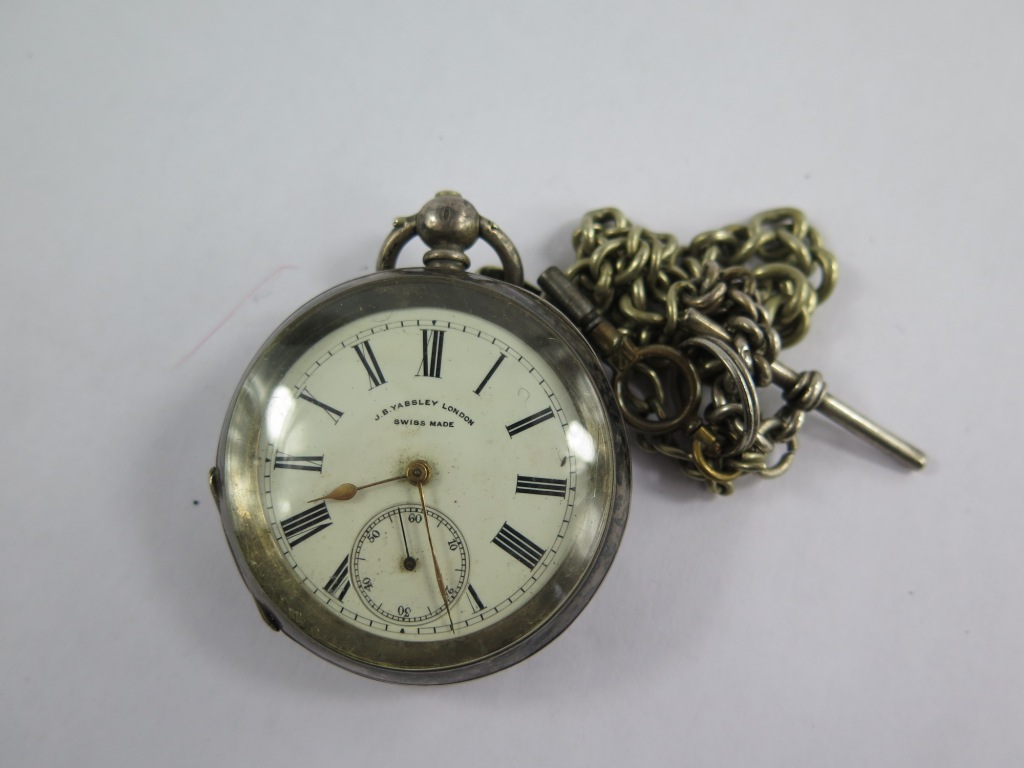 A silver pocket watch and chain