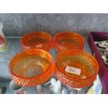 A set of four Whitefriars orange glass dimple effect bon bon dishes, cylindrical, 10cm diameter