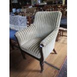 A Regency mahogany and upholstered Bergere chair, with reeded lyre shape armrests and rounded