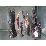 A collection of eight wood carvings from Africa and the Far East