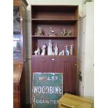 A 1970's teak bookcase cabinet with open shelves and two cupboard doors, 93cm wide, 223cm high