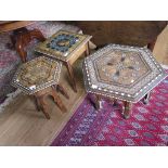 A Middle Eastern inlaid square occasional table inset with leather panel depicting a 1920s lady,