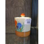 A Clarice Cliff for Newport pottery crocus pattern jam pot and cover, 9cm high