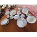 A Royal Doulton pale blue and gilt part dinner and tea service