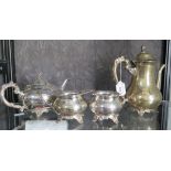 A three piece silver plated tea-set and a pear-shaped coffee pot