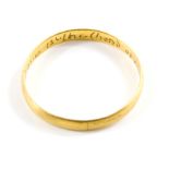 An 18th century posy ring, the plain band inscribed to the inside 'Love is the Bond of Peace',