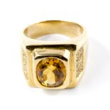 A 9 carat gold ring set with an oval citrine and white topaz, with certificate