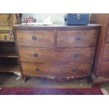 A George III mahogany bowfront chest of drawers with two short and two long drawers on outsplayed