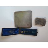 A silver cigarette case, a silver vesta, etc